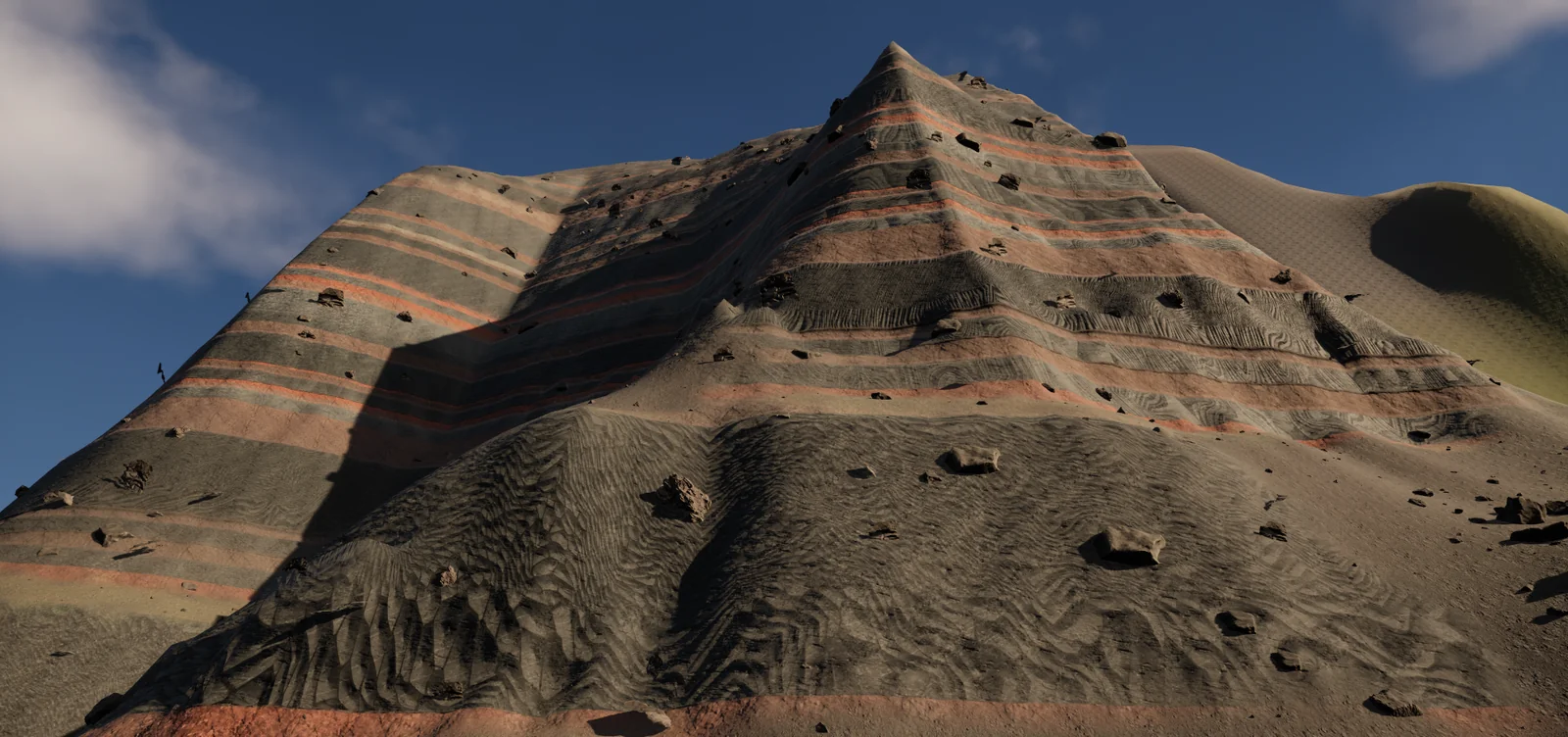 At the foot of a layered cliff