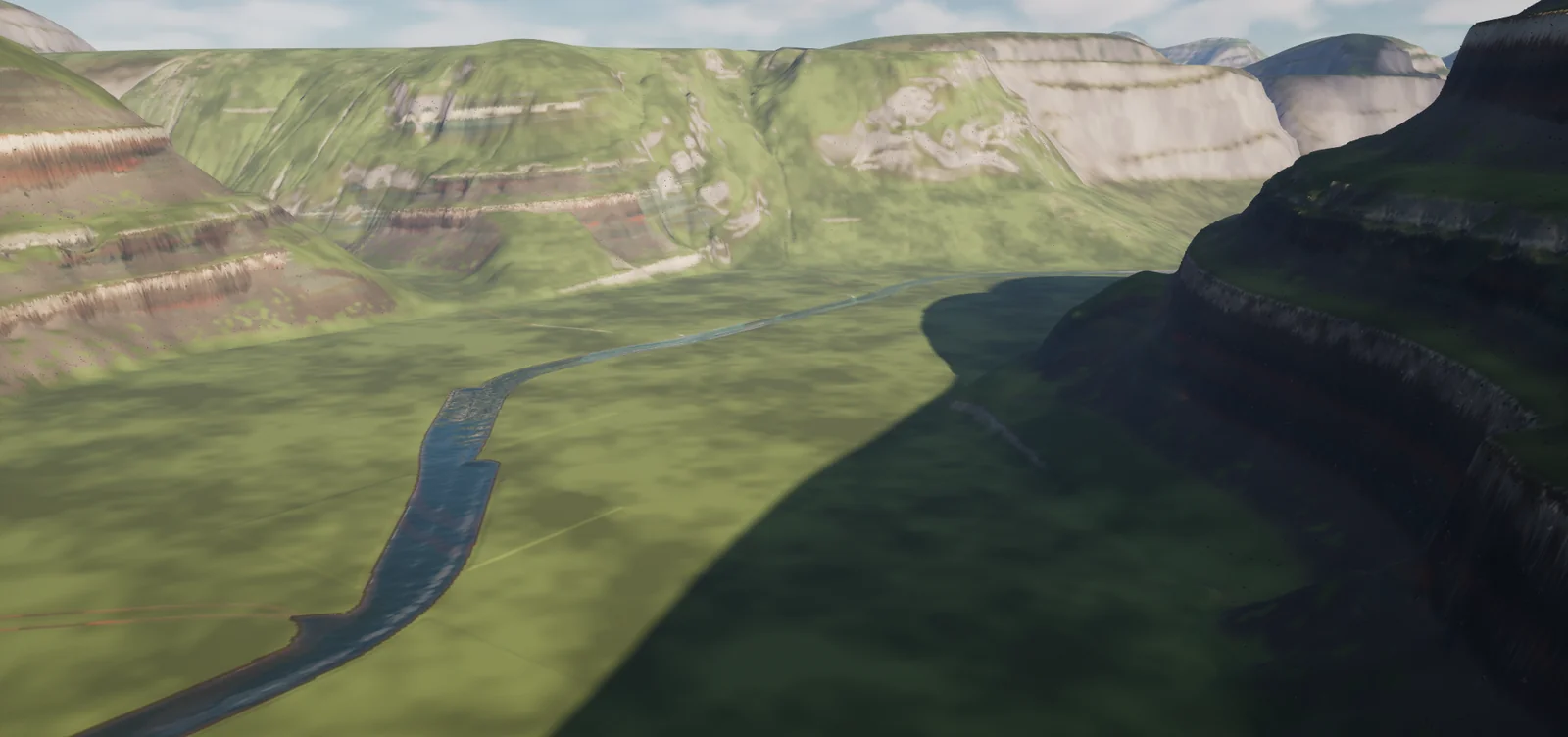 A river winding between stepped walls
